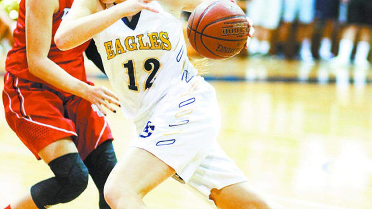 Arroyo Grande High’s Ashlyn Herlihy drives around Tesoro's Kasey Smit during a Feb. 25 CIF-Southern Section girls basketball playoff game at Arroyo Grande.