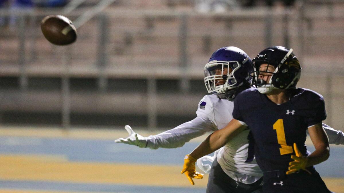 Brandon Butler of Arroyo Grande breaks up a pass to Monte Ortiz of Lompoc. Arroyo Grande fell to Lompoc 42-37 in a hard-fought Mountain League football opener on Sept. 16, 2022.