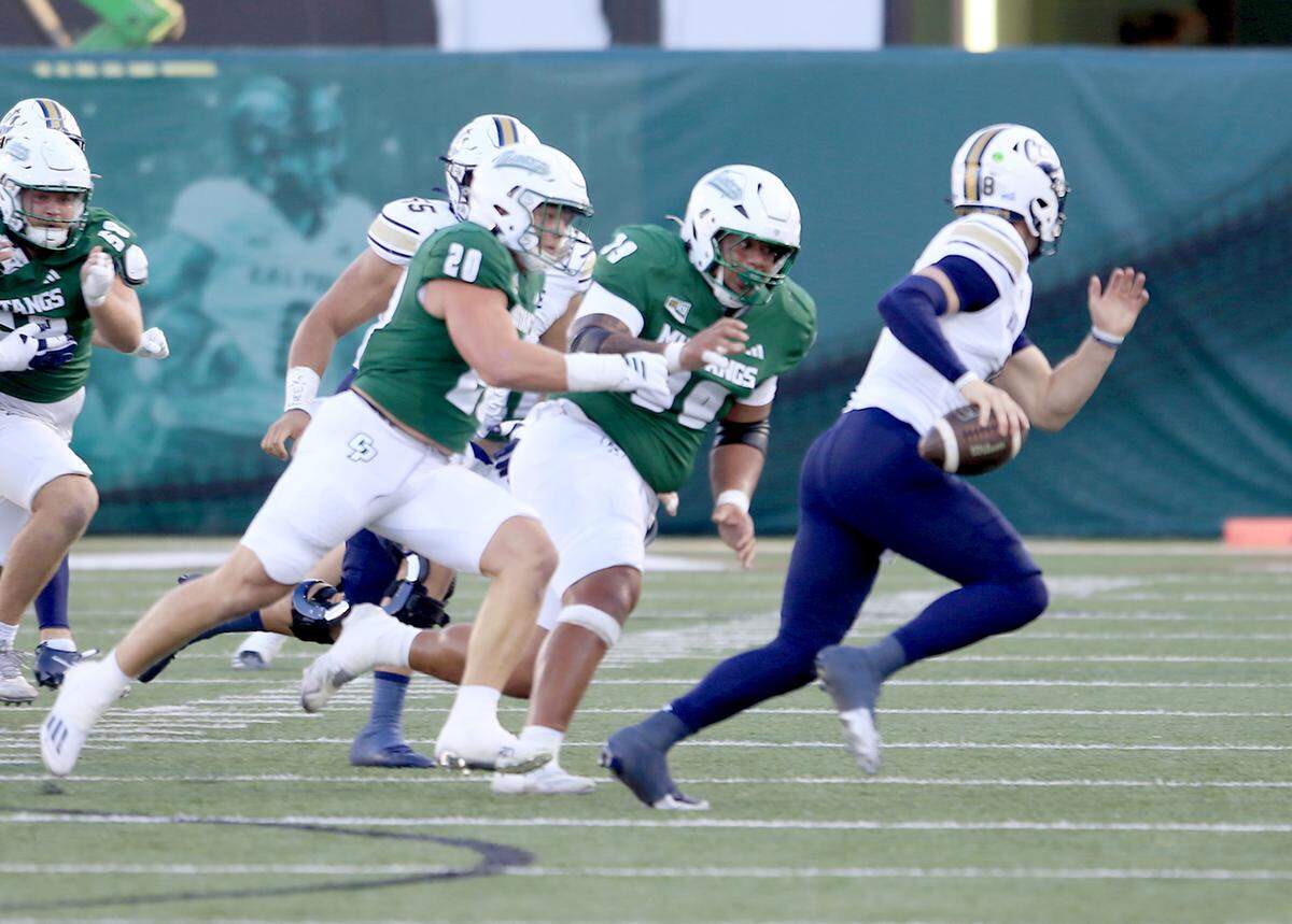 Mustang linebackers Kenny Olson and Miles Medina go after Bobcats' quarterback Justin Lamson. Cal Poly fell to Montana State 34-17 in a college football game at Mustang Memorial Field on Oct. 25, 2025.