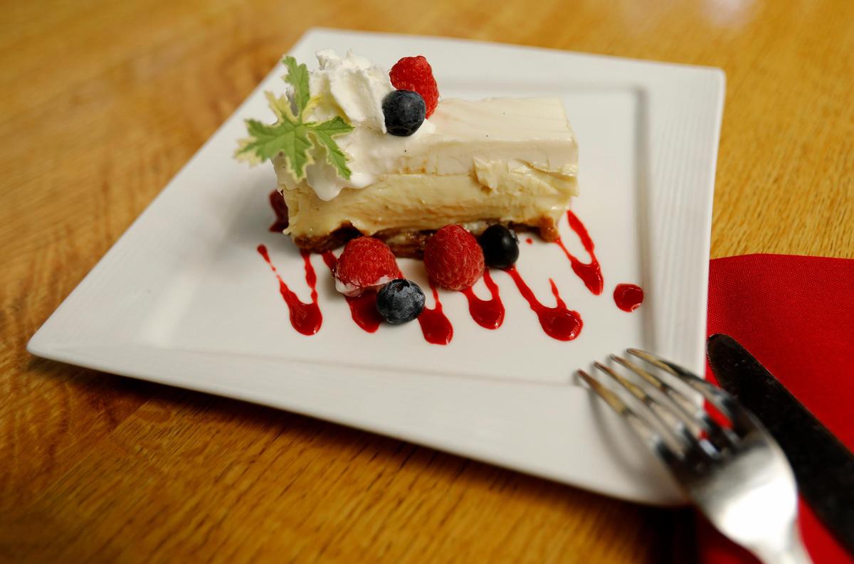 Dessert options at Robin’s Restaurant in Cambria include a double-layer lime pie with fresh berries and raspberry coulis.
