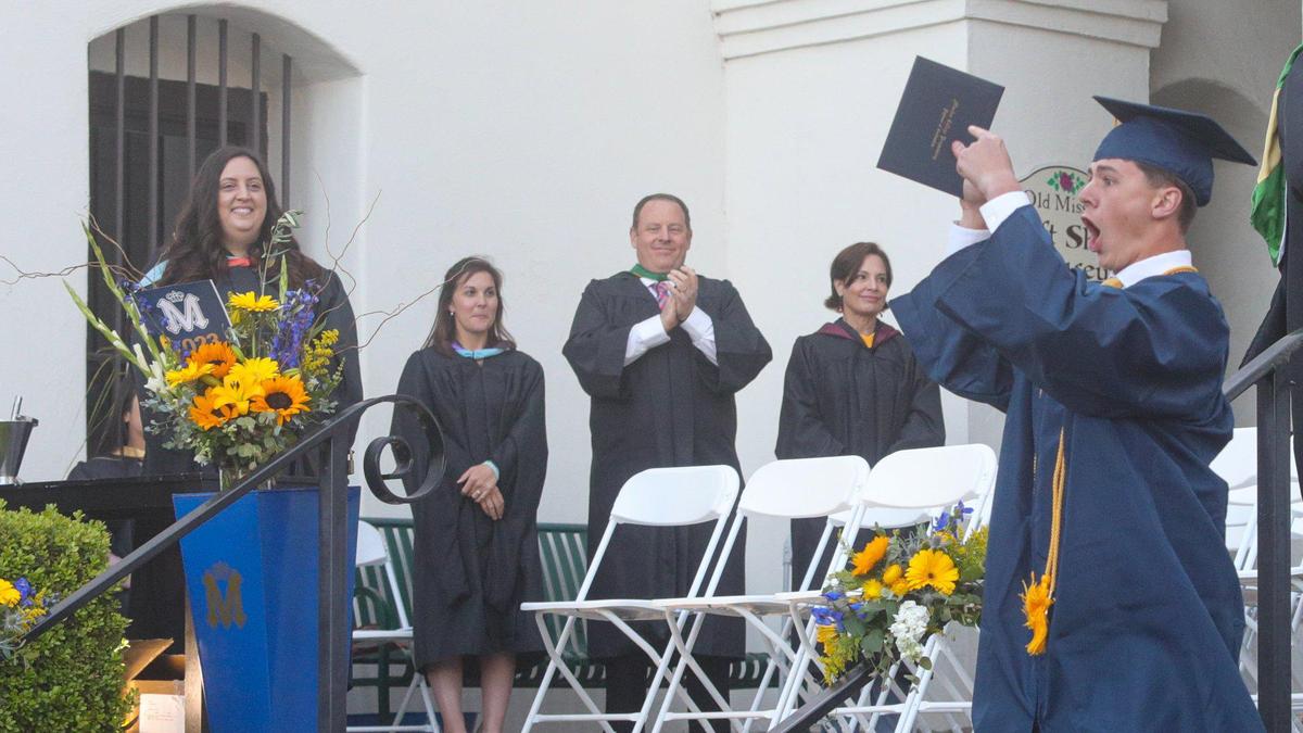 Colby White celebrates his diploma as Mission Prep graduated 61 students on the steps of Mission San Luis Obispo on Friday, June, 2, 2023.