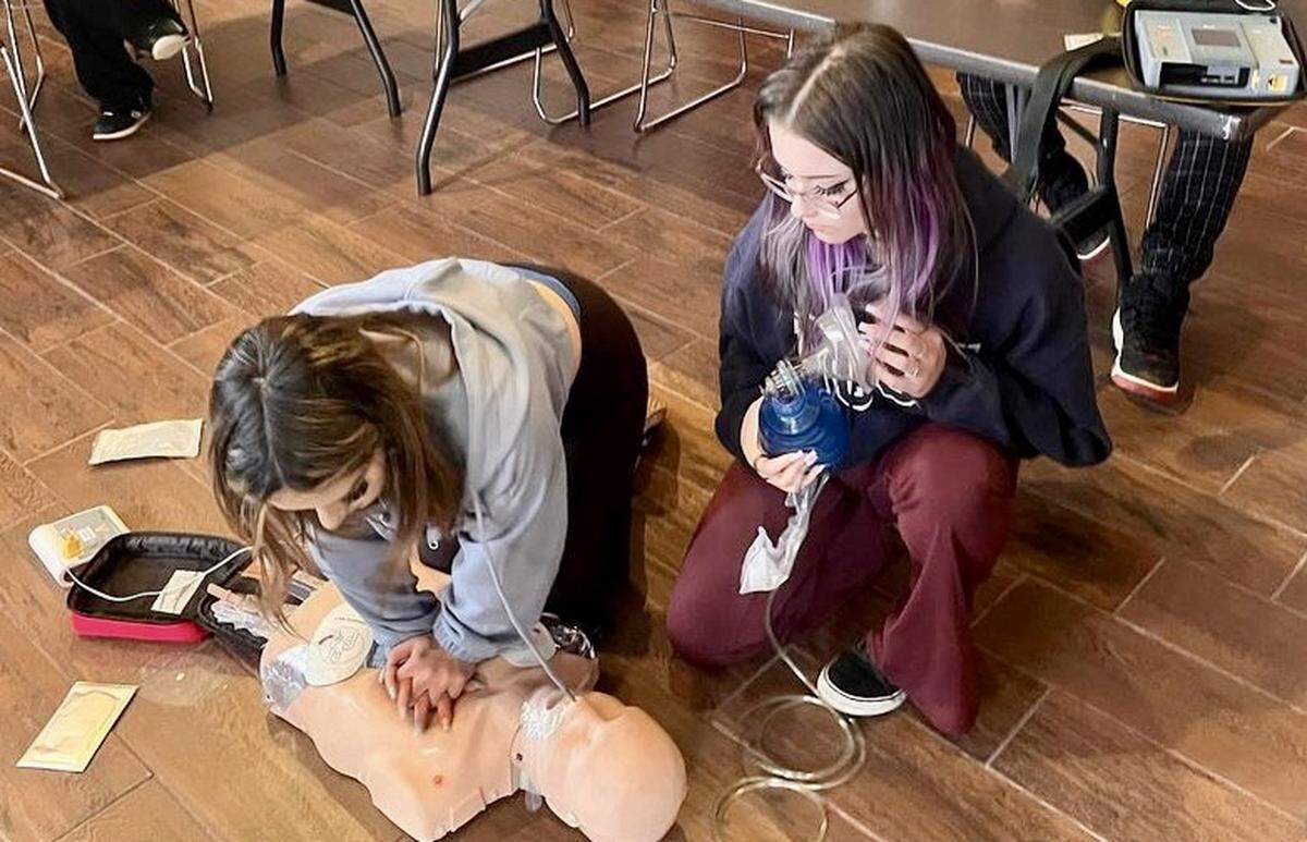Students at Leffingwell High School in Cambria practice CPR on a dummy during a training session hosted by Cambria Community Healthcare Services District.