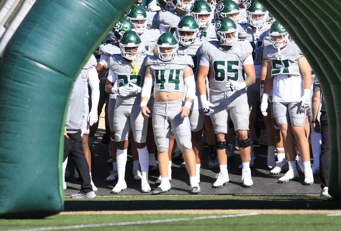 Mustang football players await the start of the game. Cal Poly fell to Portland State 40-35 in a college football game at Mustang Memorial Field on Nov. 1, 2025.