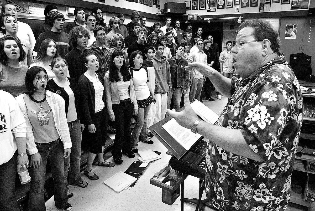 Gary Lamprecht conducts a rehearsal for the Morro Bay and San Luis Obispo high schools choirs on Feb. 24, 2005.