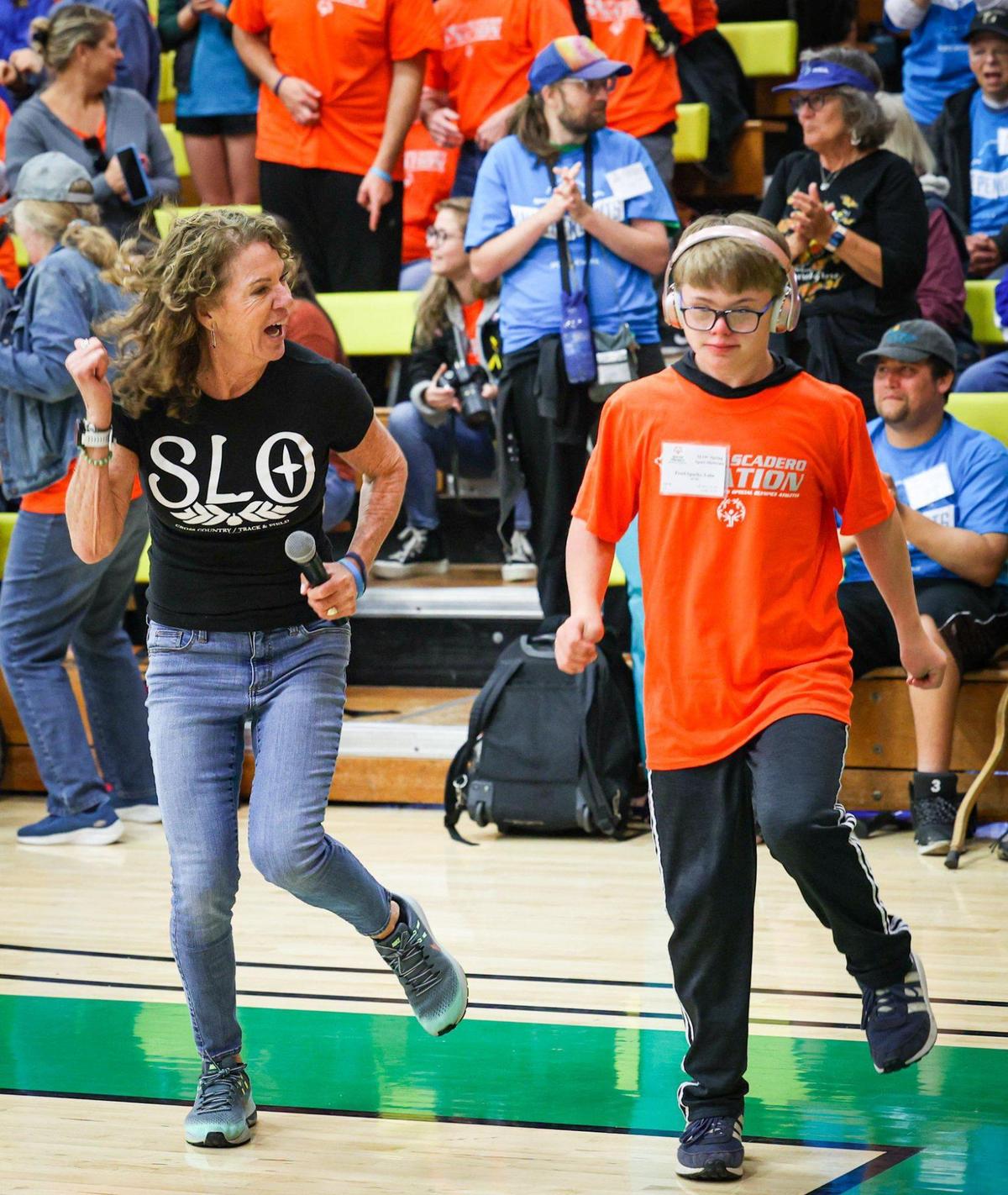 Jani Johnson, retired Cuesta College faculty member dances with Luke Freel-Sparks during opening ceremonies at the Cuesta Gym. Special Olympics returned to Cuesta College after a three year hiatus due to Covid restrictions May 5, 2023/
