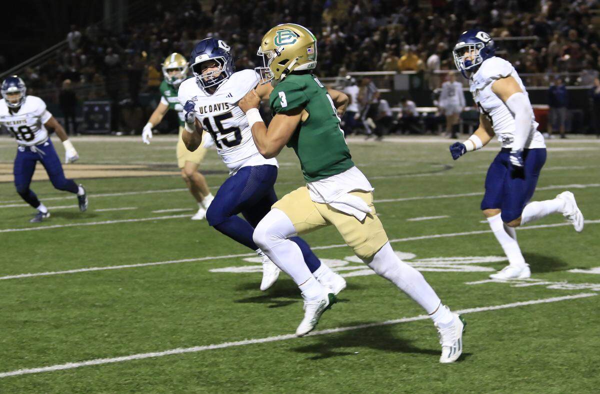 Mustang quarterback Bo Kelly decides to run with the ball. Cal Poly lost to UC Davis 34-27 in a college football game at Mustang Memorial Stadium on Oct. 4, 2025.