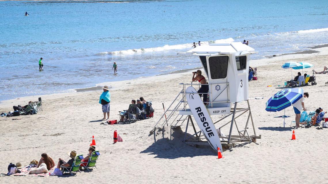 Lifeguard Delci Sawyer keeps a watchful eye on holiday crowd at the Olde Port Beach near Avila Beach on July 1, 2024.