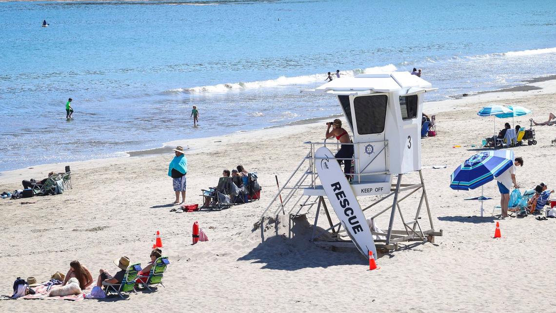 Lifeguard Delci Sawyer keeps a watchful eye on holiday crowd at the Olde Port Beach near Avila Beach on July 1, 2024.