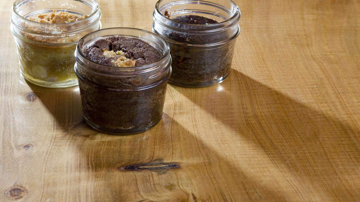 Bombshell Brownie Co. in Cambria bakes up brownies in jars. Clockwise from left are a lemon chiffon brownie, a blood orange and hazelnut brownie, and Mutter's German chocolate brownie.
