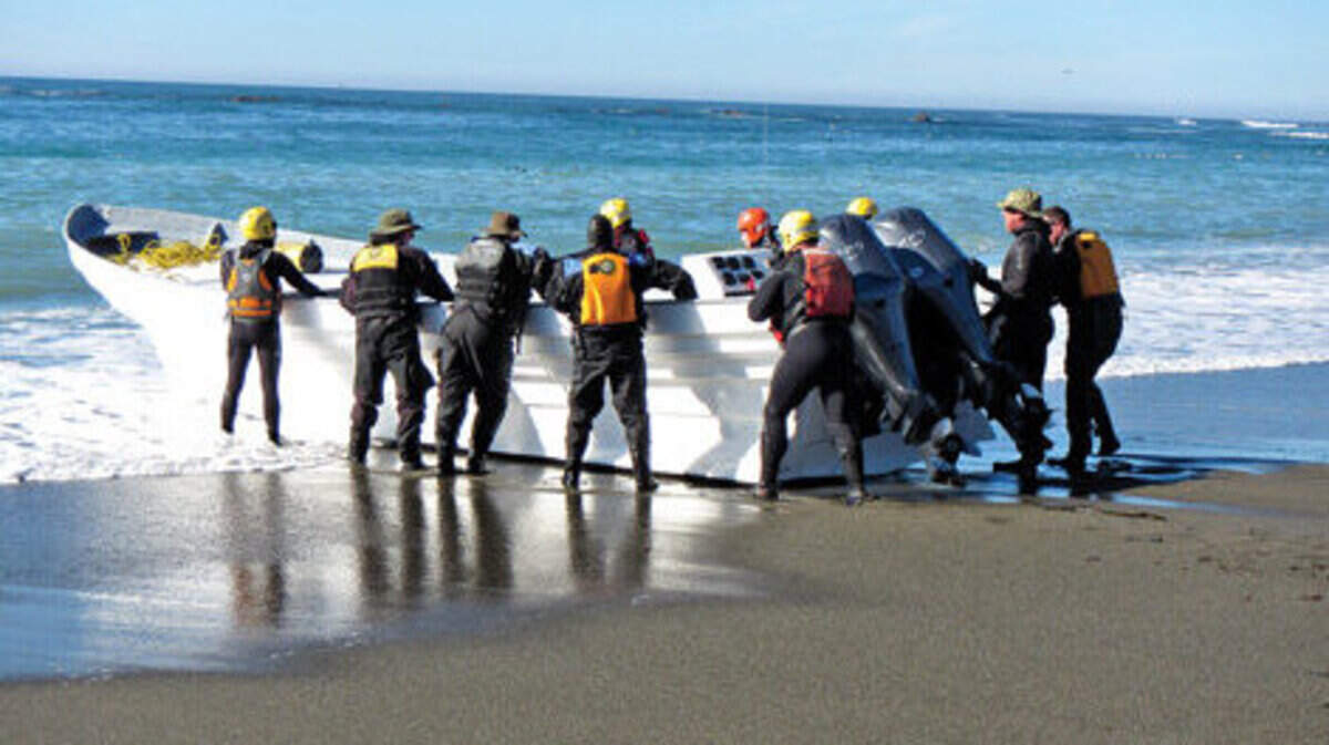 An abandoned panga boat was discovered Monday on the beach north of the Piedras Blancas Light Station near San Simeon. Members of the Sheriff’s Dive Team and North Coast Ocean Rescue Team convened Tuesday to relaunch the panga at high tide.