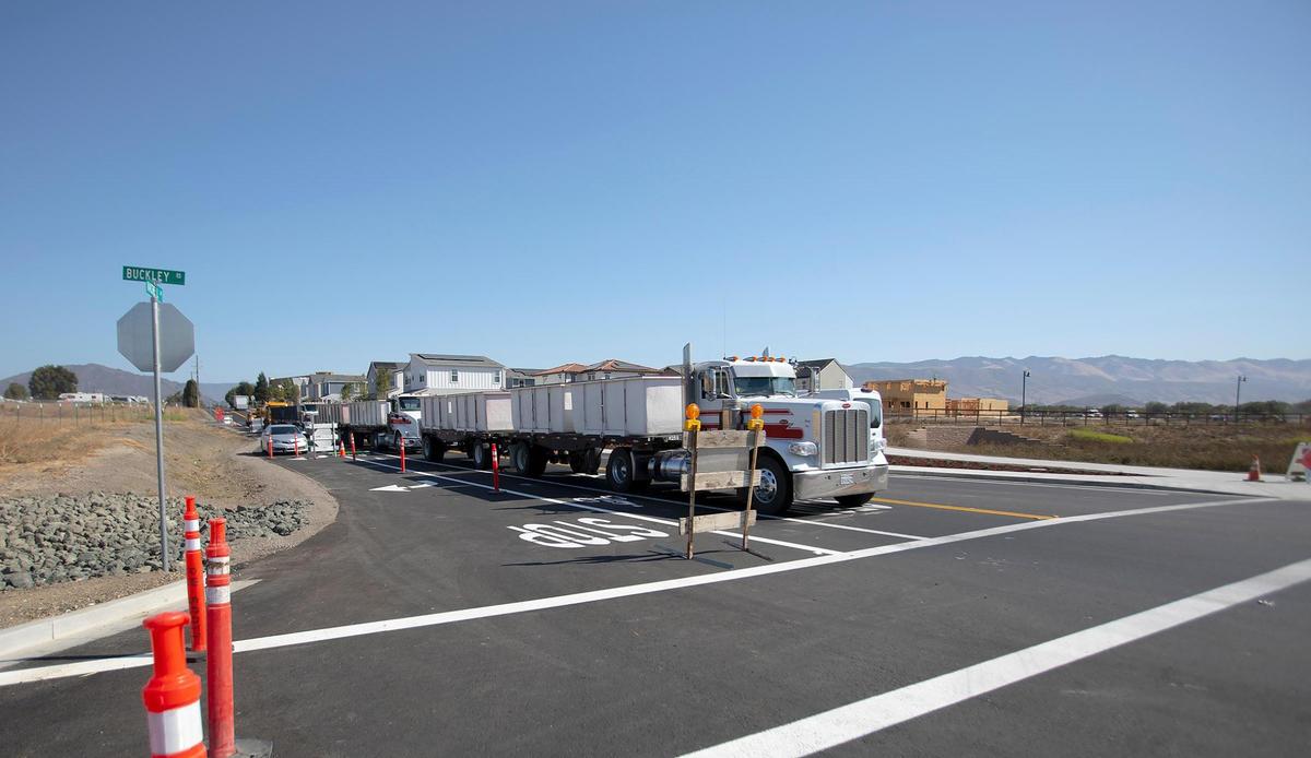 Work is completed and the Buckley Road and South Higuera Street intersection will be open for traffic Saturday, Sept 10, 2022. Traffic waits for a highway worker to let them pass at the Buckley Road and Vachell Lane intersection, Tuesday, Sept. 6, 2022.