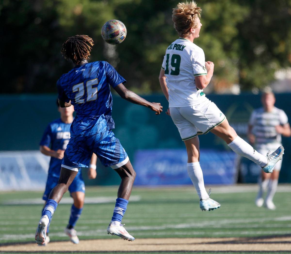 UC Santa Barbara’s Manu Duah competes with Quinn Mahoney for a header. Cal Poly beat UCSB 2-0 in the annual Blue-Green Rivalry soccer game on Sept. 28, 2024.