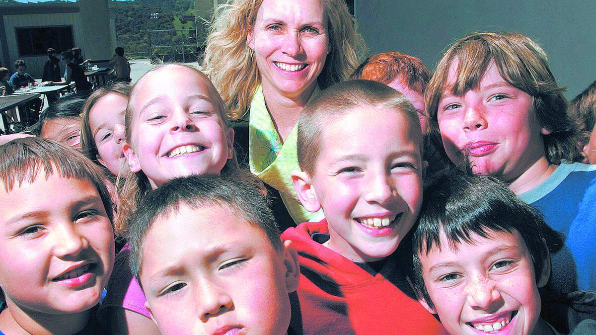 Atascadero Unified School District Superintendent Deborah Bowers, center, is retiring at the end of June, capping off a lengthy career in education. Here she seen in 2006 with students from Vineyard Elementary School.