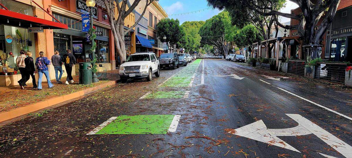Debris covers Higuera Street in downtown San Luis Obispo on Sunday, Dec. 11, 2022, following a wind-driven rainstorm.