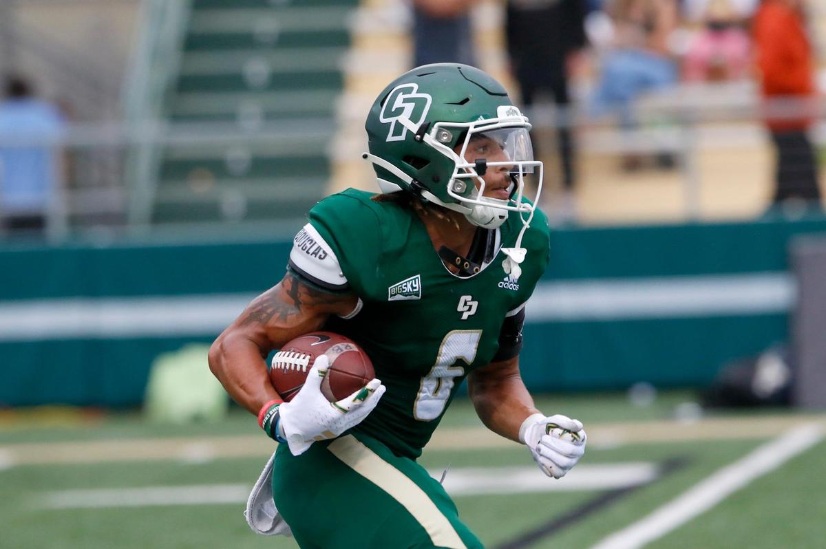 Mustang ball carrier Xavier Oliphant looks for a opening in Cal Poly’s 27-10 win over the University of San Diego at Alex G. Spanos Stadium on Sept. 2, 2023.