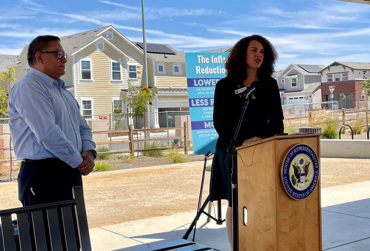 San Luis Obispo Mayor Erica Stewart speaks at a press conference about the Inflation Reduction Act on Aug. 11, 2022, with Rep. Salud Carbajal.