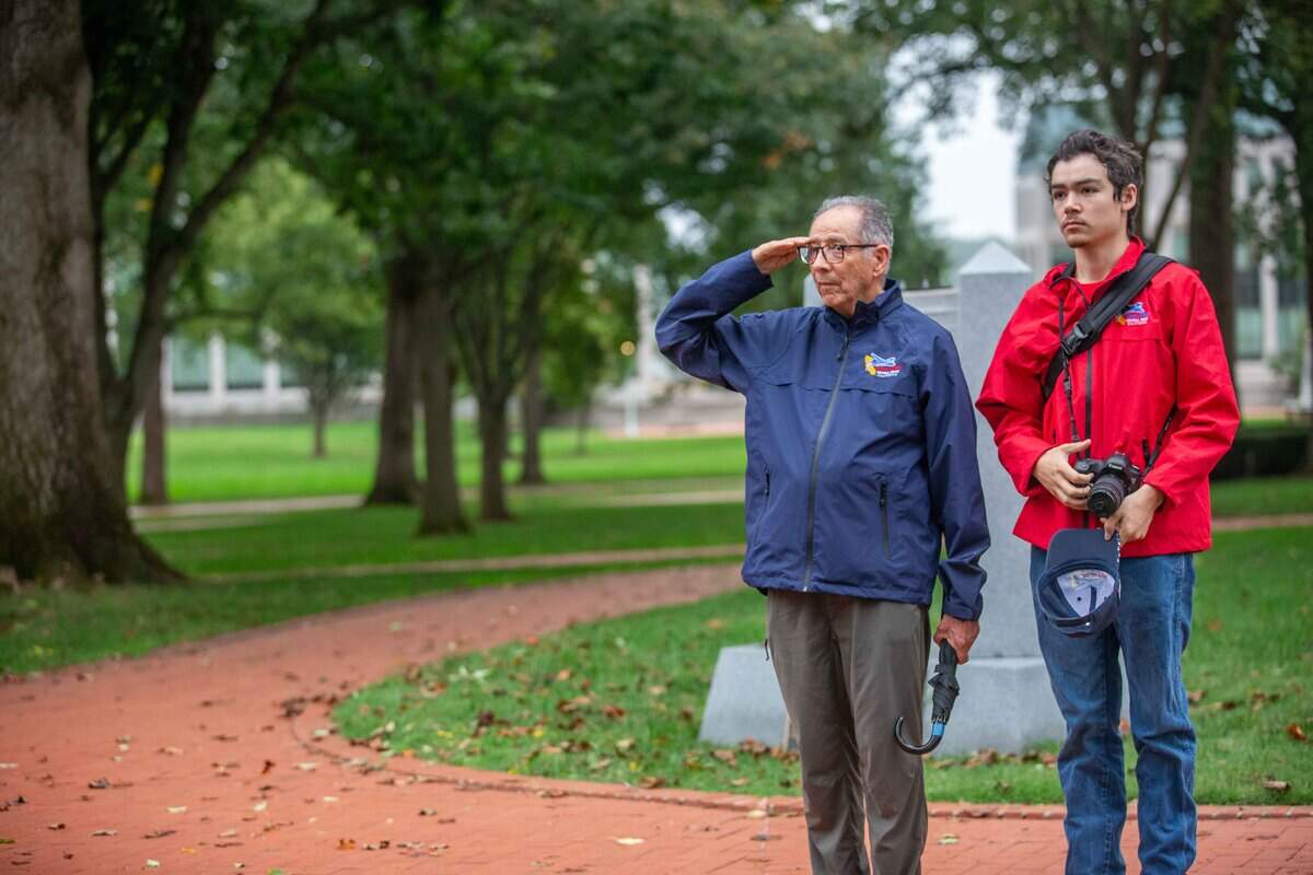 Vietnam-era Navy Seabee officer Dr. Sam Vigil poses with his grandson and guardian, Nathan Danner, during an Honor Flight Central Coast California trip to Washington, D.C. Danner said the experience transformed history into something deeply personal.