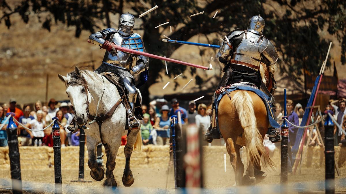 Brian Stephenson, left, and Charlie St. Andrews have the tips of their lances explode on contact as they joust during the 34th Annual Central Coast Renaissance Festival at Laguna Lake Park.