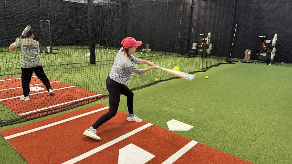 Tribune reporter Sadie Dittenber connects on a pitch in the batting cage at SLO Swing Sports on Oct. 10, 2025.