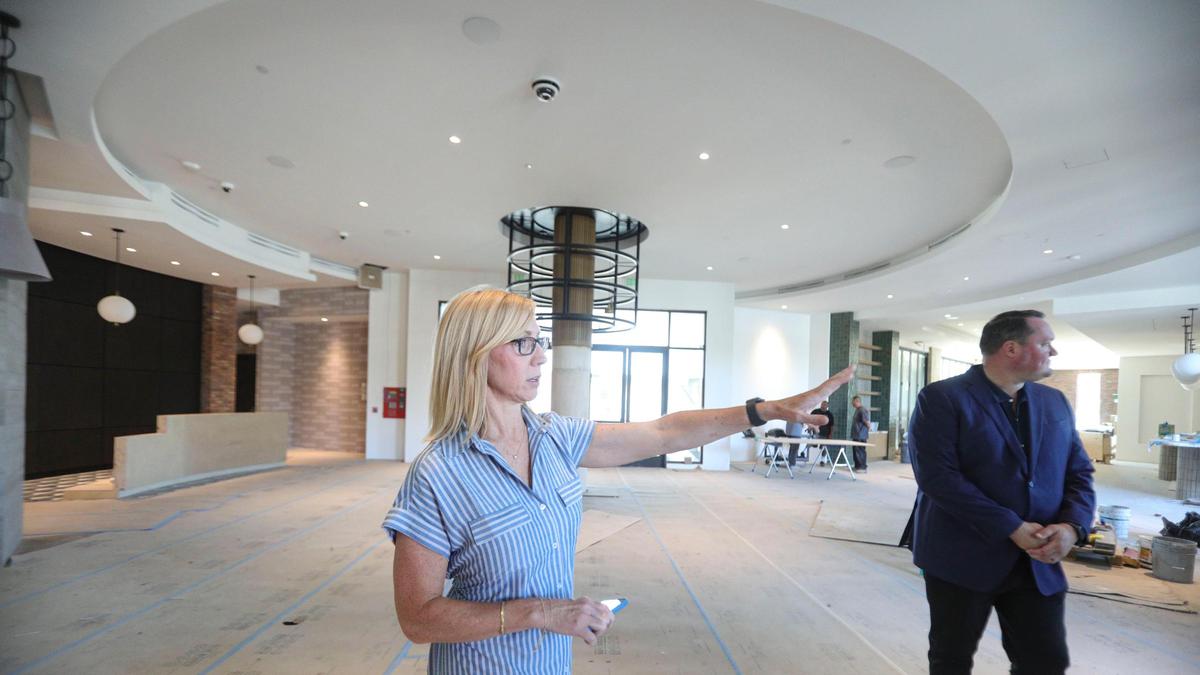 Corina Ketchum, director of sales and marketing at The Ava Hotel in downtown Paso Robles, shows the lobby of the 151-room destination. Matthew Kleefisch, general manager is at right. The Ava Hotel is in the finishing months of construction, seen here on June 18, 2025.