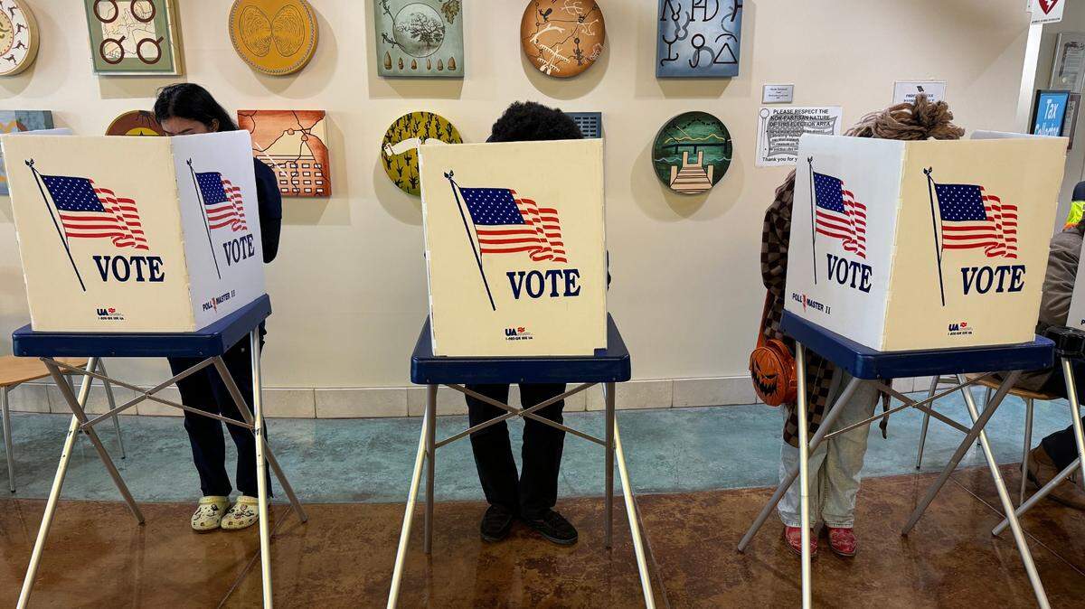 Voters fill out their ballots at the San Luis Obispo County elections office on Nov. 5, 2024.