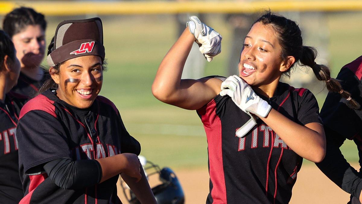 Melania Ruelas points to her arm after knocking in the game-winning run during Tuesday’s game.