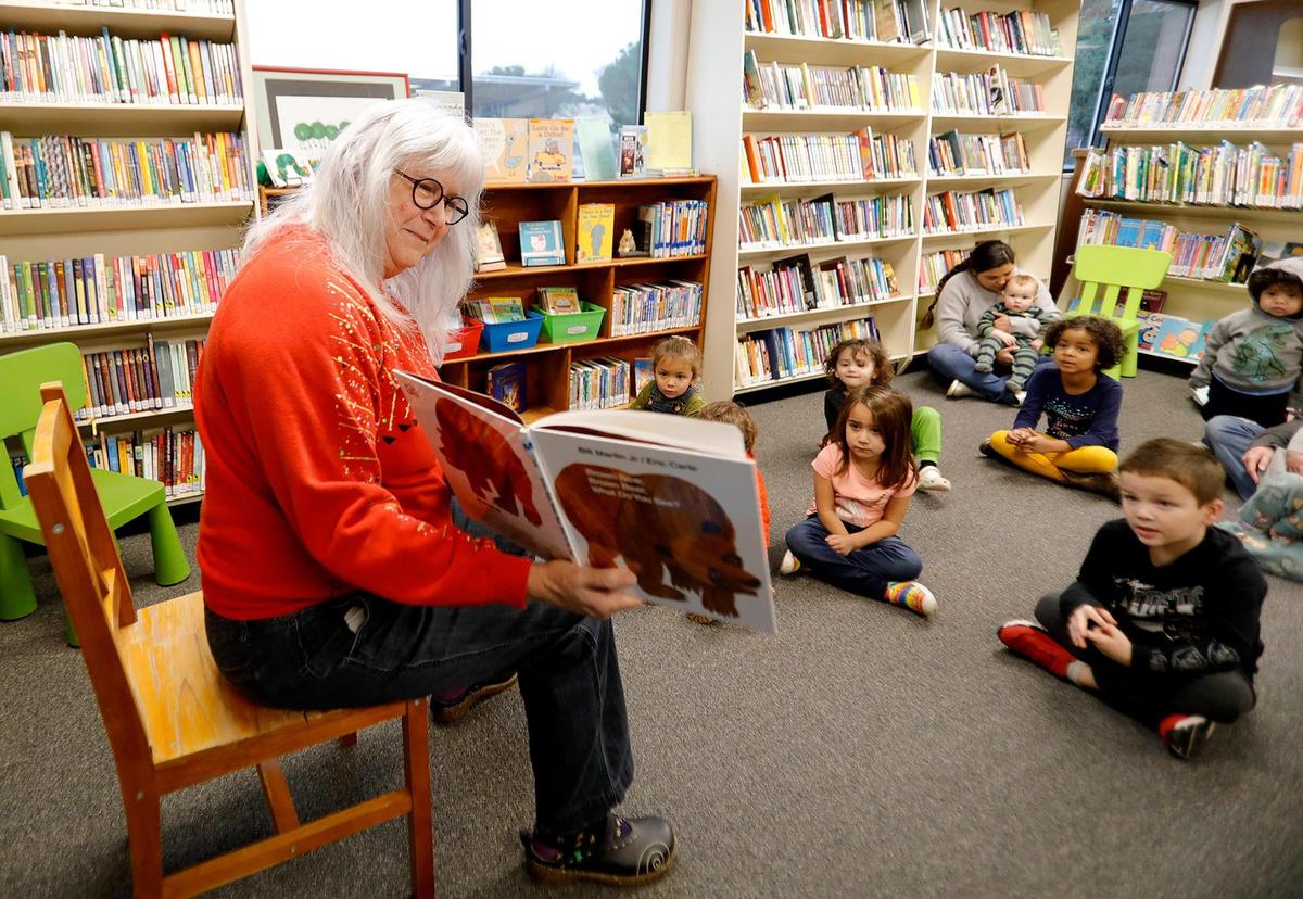 Children attend a lively story hour at the new Templeton Community Library, led by Kristen Barnhart, retired librarian and volunteer story reader.