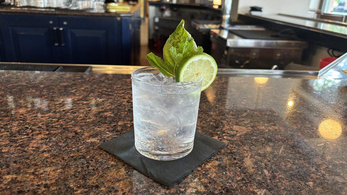 The gin and tonic from the Mabel Lounge's bar. The Mabel Lounge opened on May 13 inside The Carlton Hotel, serving small bites and plates in a cozy, intimate atmosphere.