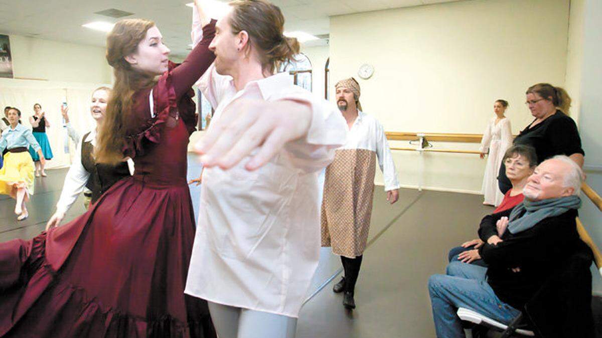 Gilbert Reed, bottom right, admires the work of, from left, Young Scrooge's Betrothed played by Michelle McLaughlin, Young Scrooge played by Ryan Beck and Old Scrooge played by Thomas Johantgen during a dress rehearsal for "A Christmas Carol."  Originally created by choreographer Gilbert Reed, " A Christmas Carol" was last performed eight years ago by the Gilbert Reed Ballet.  Now, with Reed's help, artistic director Theresa Slobodnik and her dancers are reviving the ballet based on Charles Dickens' classic tale for the 2010 holiday season.
Photo by Nick Lucero 11-20-10