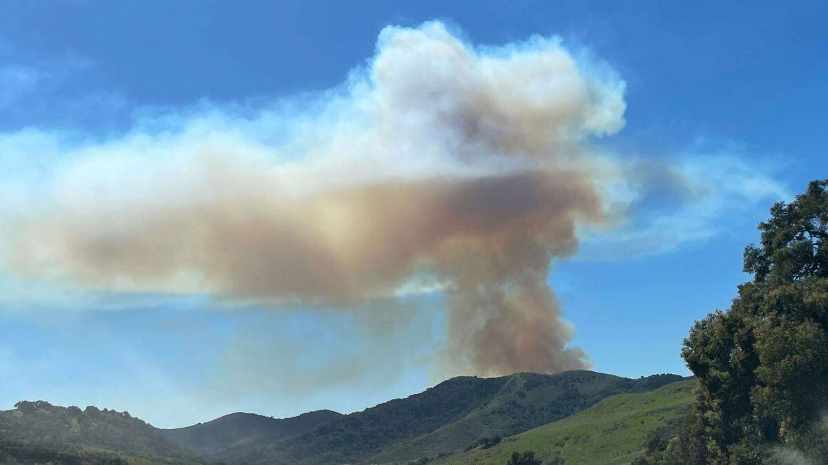 Smoke rises from a vegetation fire burning Saturday afternoon, March 12, 2022, on Hollister Ranch near Gaviota.