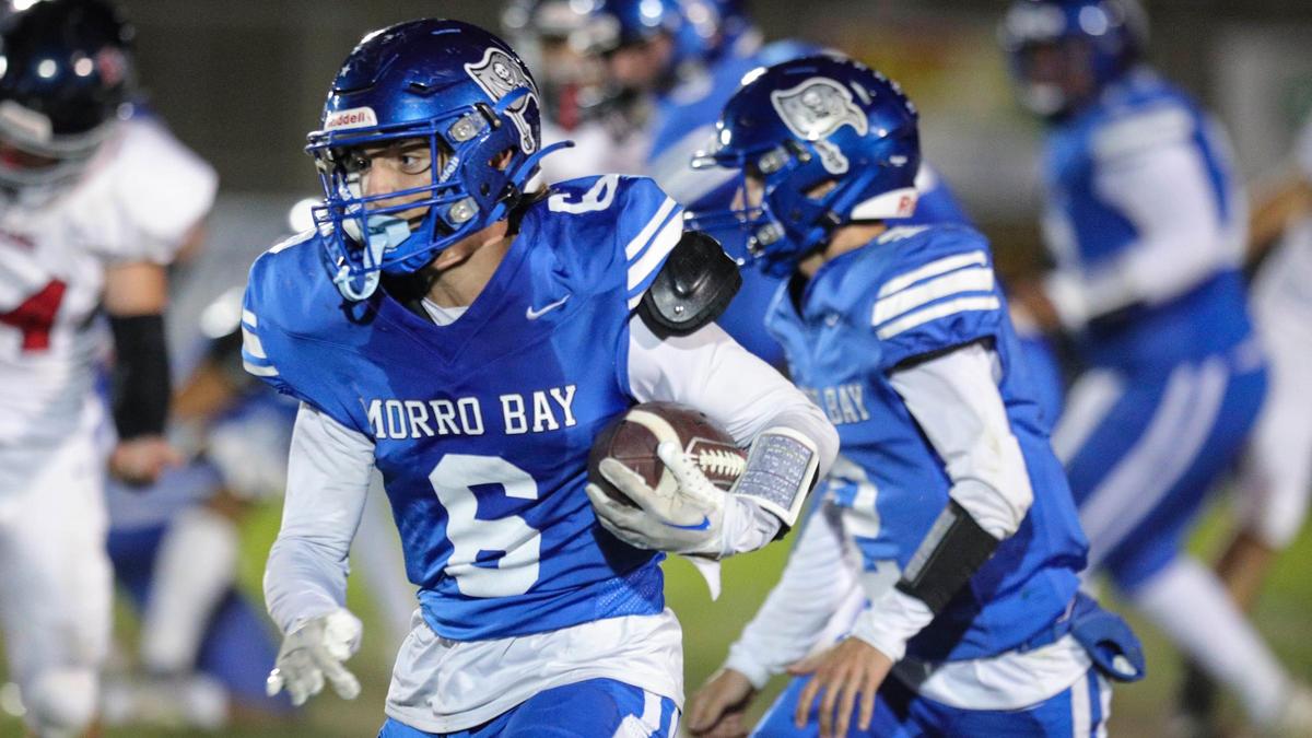 Caleb Calhoun carries the ball in Morro Bay’s 27-26 victory over East Bakersfield in the CIF Central Section Division 5 playoffs on Nov. 3, 2023.