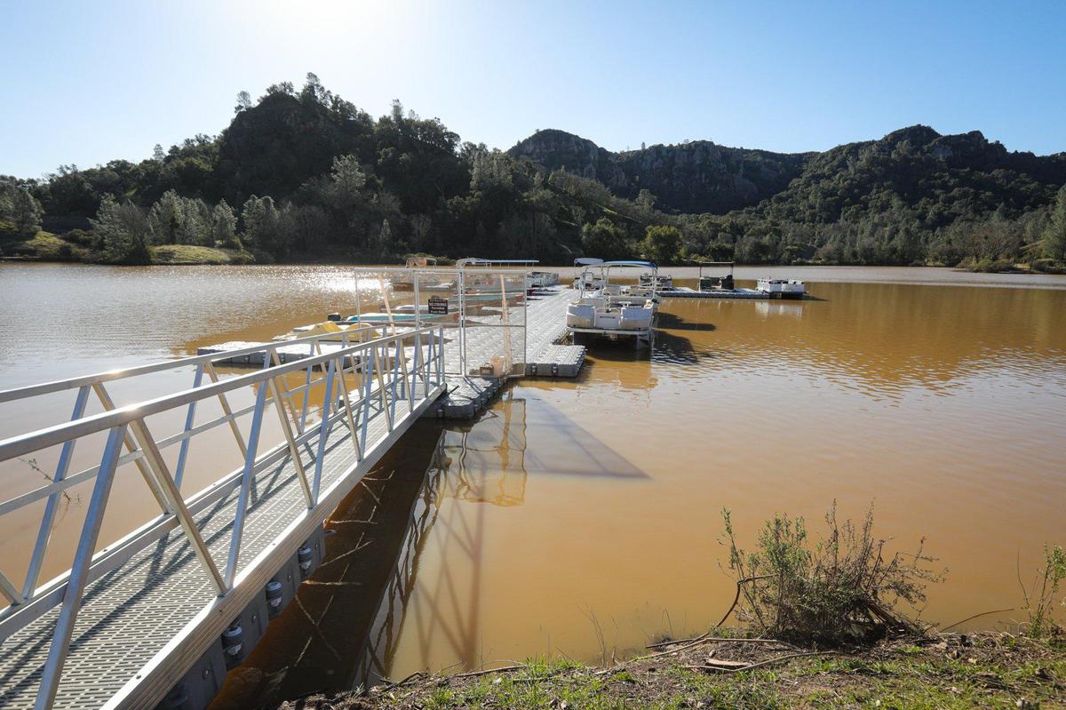 Santa Margarita Lake was standing at 101% capacity on Feb. 15, 2023 with docks at maximum lake level and all boat launch ramps open and fishing enthusiasts hoping the water will clear.