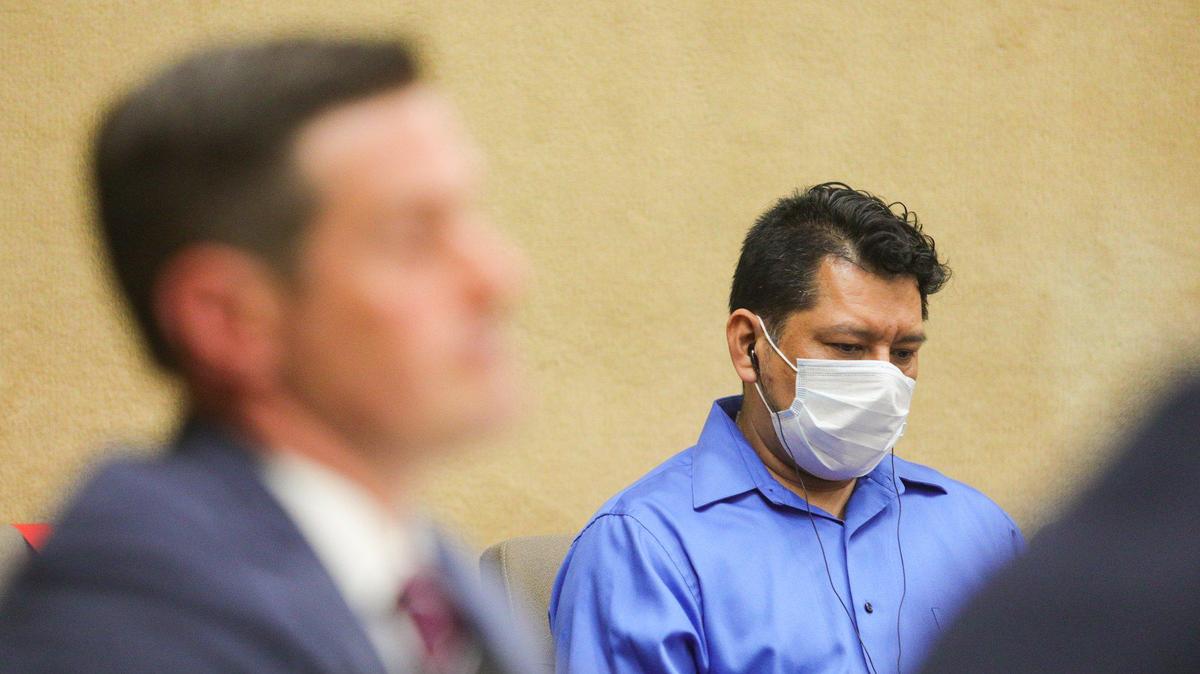 Carlo Fuentes Flores listens to translation in court during his preliminary hearing on Sept. 9, 2020. He has been found guilty of killing Paso Robles hair stylist Nancy Woodrum, who was missing for months in 2018. Deputy DA Christopher Peuvrelle is in the foreground.