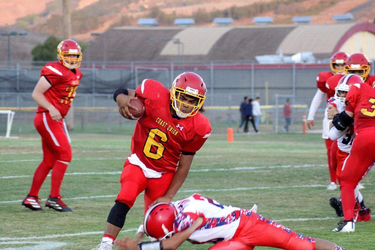 Bronco senior quarterback Emi Pena, who is highly effective at running the ball, is expected to provide strong leadership for the Coast Union High School team, according to head coach Andrew Crosby.
