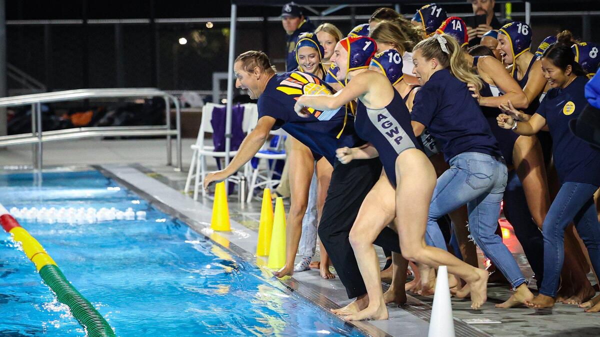 Coaches and players took a dunk in the pool as Arroyo Grande High School girls water polo team celebrated 20 consecutive league championships with coach Steven Allen. They defeated Morro Bay 15-5 Thursday, Oct. 27, 2022.