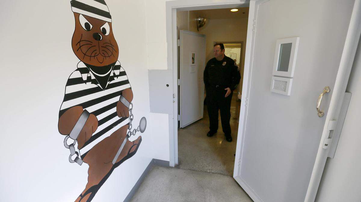 Sgt. Steven Bowles gives a tour on Nov. 29, 2016, where pay-to-stay program inmates can watch television, socialize and play games at the Seal Beach Detention Center.