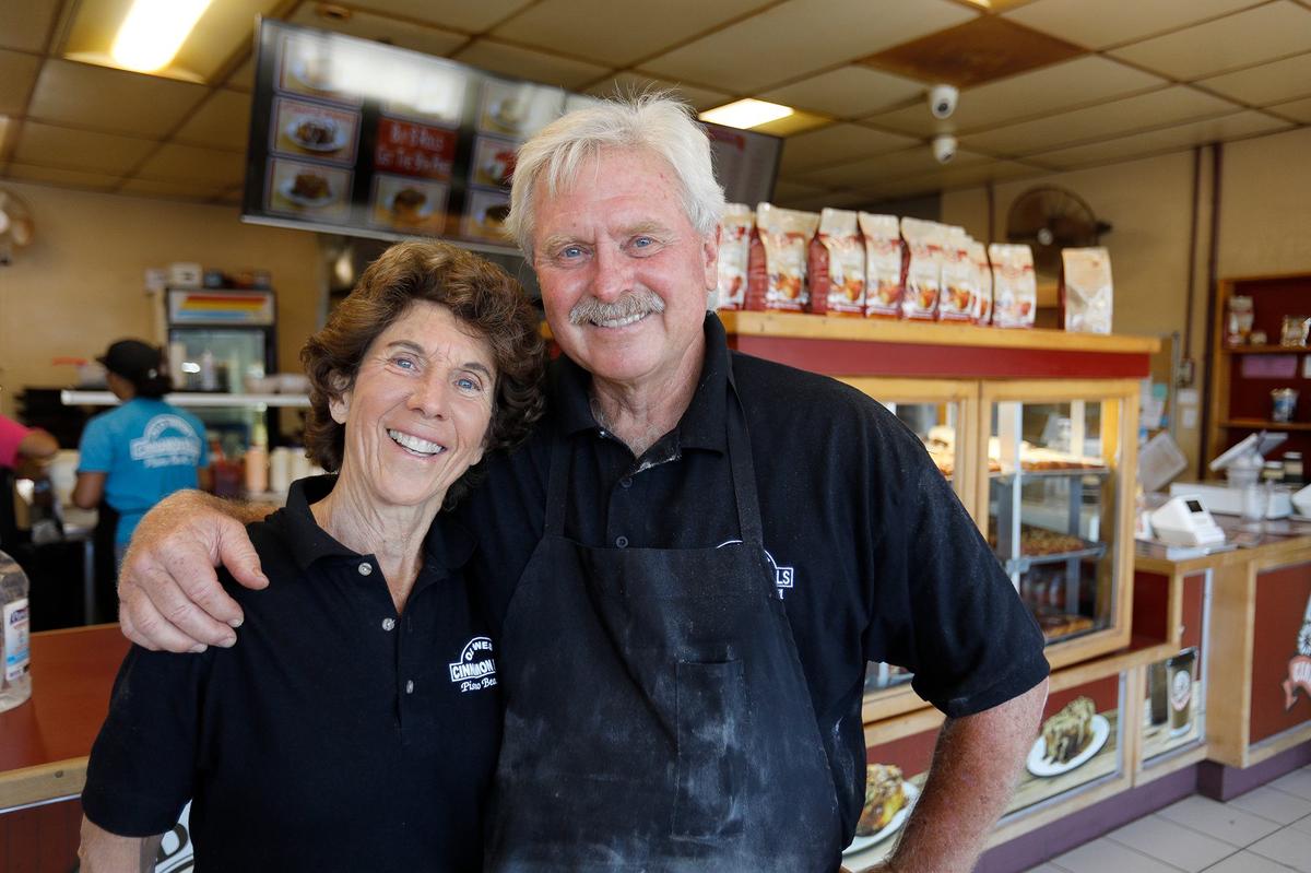 Old West Cinnamon Rolls co-owner Joe Parkhurst with wife Cindy at the shop in Pismo Beach in July 2024.