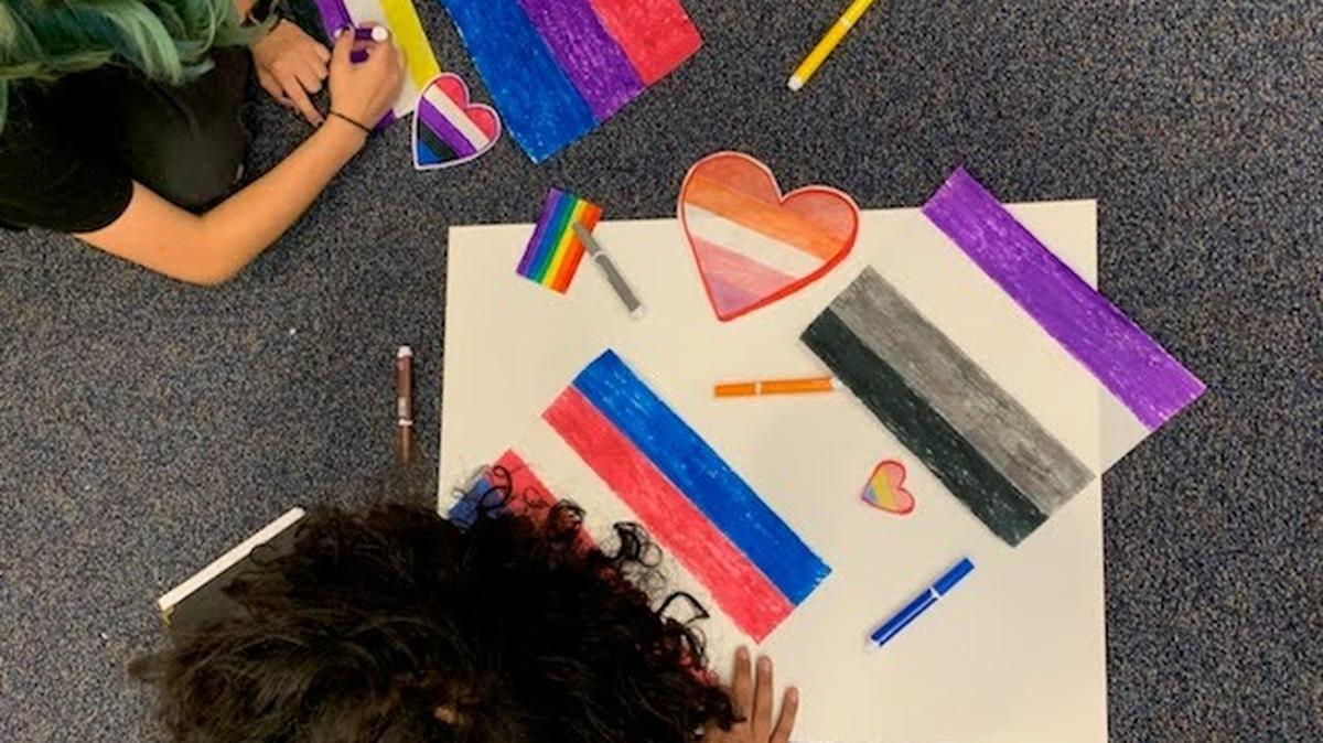 Students at Paso Robles High School create signs promoting love and inclusion after an incident in which an LGBTQ Pride flag was stolen from a classroom and defecated on. 