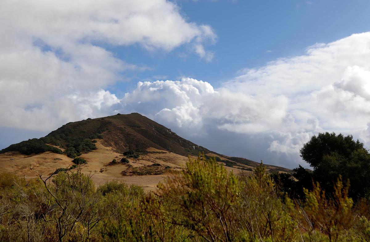 Beautiful storms clouds hover over Cerro San Luis after a break in the rain on Wednesday, Nov. 27, 2019.