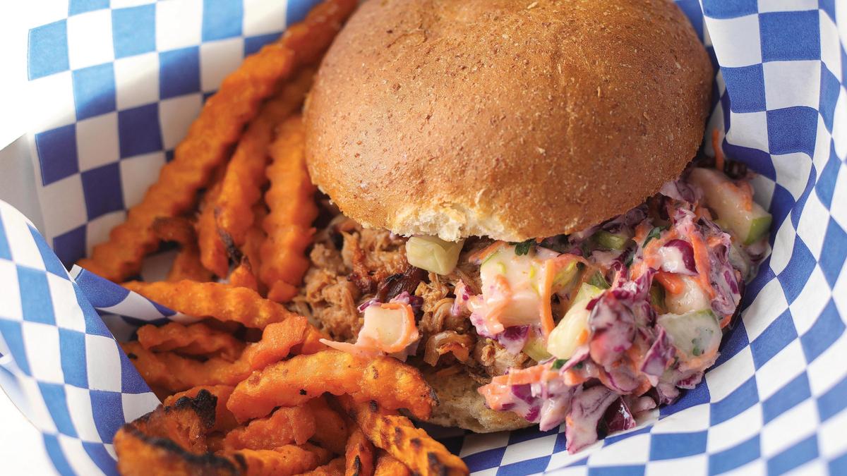 San Luis Coastal school district works with a nonprofit called Slow Money SLO, which helps bring, healthy local food awareness in schools, while supporting the local farming community. Here, a pulled-pork sandwich with sweet potato fries.