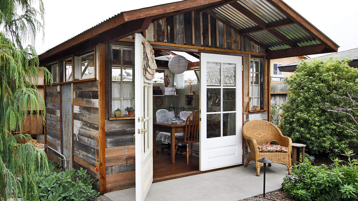Ray and Lisa Purcell's recycled greenhouse is used as a sewing room.
Photo by Joe Johnston 02-17-15