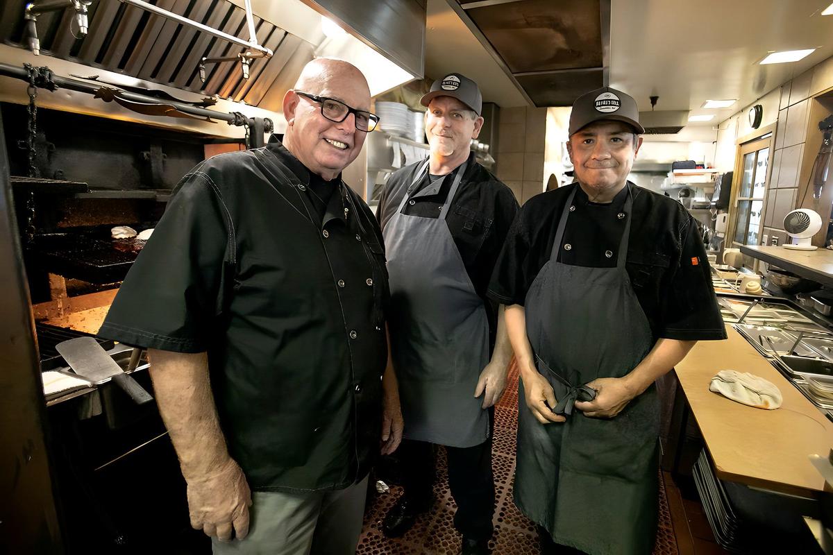 Tim Crell, center, and Fernando Hernandez, right, followed chef Ian McPhee from Ian’s restaurant in Cambria to McPhee’s Grill in Templeton. They’ve been with him for 35 years. The restaurant is celebrating its 30th anniversary this year.