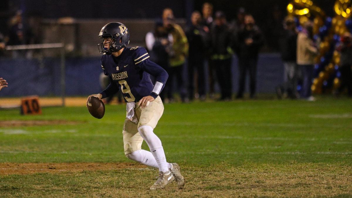 Quarterback Colby White scrambles with the ball. Mission Prep fell to St. Joseph 49-21 on Oct. 28, 2022, in the last game of the regular season, giving the Knights the Mountain League football championship.