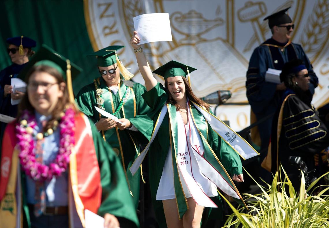 Cal Poly kicked off graduation weekend with three ceremonies on June 15, 2024. The university expects to celebrate more than 6,300 graduates throughout the weekend. Chloe Croll, an Expedience Industry Management graduate, shows off her diploma.