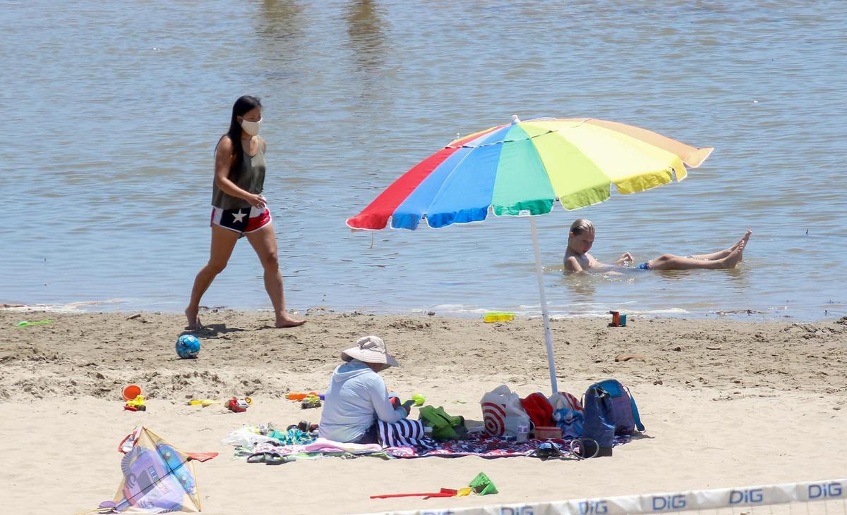 San Luis Obispo County beaches were not closed for the Fourth of July weekend during the 2020 coronavirus pandemic. Some people we wearing masks on the beach and while strolling in town.