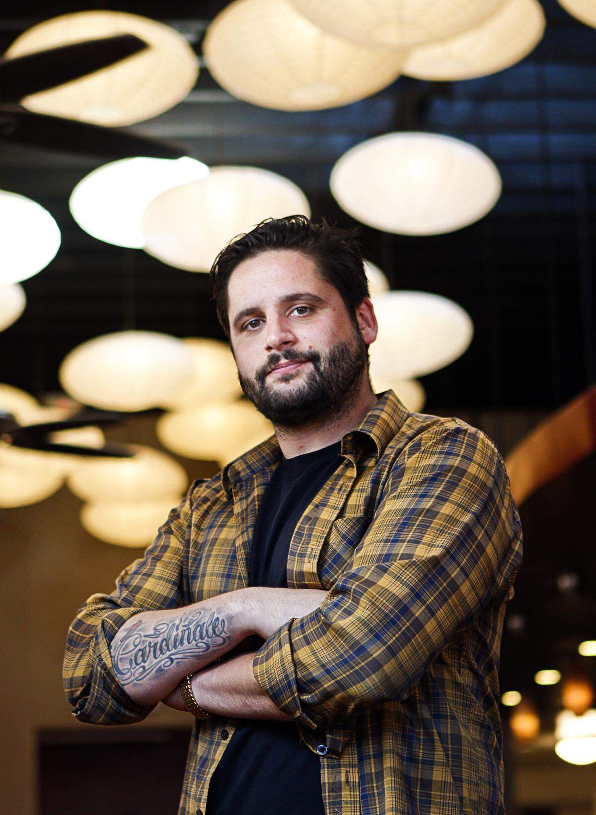Daniel Cardinale handles social media for the Naked Fish restaurant in Downtown San Luis Obispo. Photo by Joe Johnston 03-25-15
