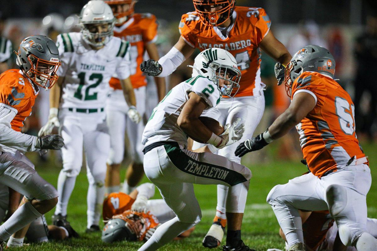 Dylan Kriling runs in traffic. The Atascadero Greyhounds beat the Templeton Eagles 27-21. Atascadero high School hosted Templeton in Ocean League football on Oct. 7, 2022.
