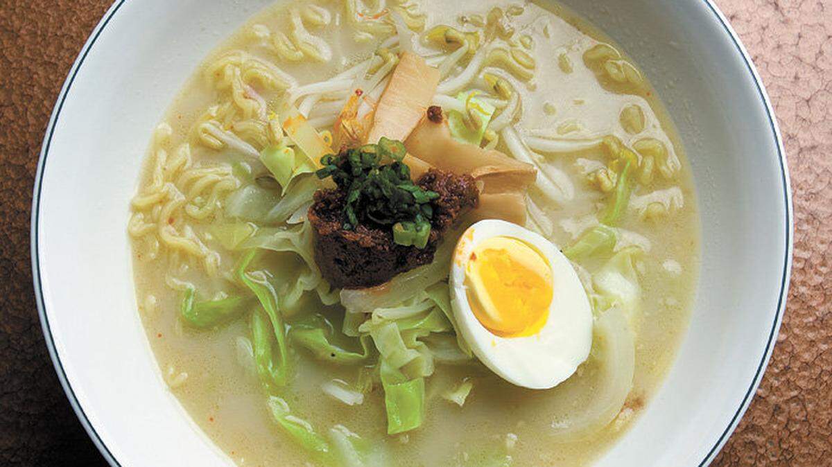 A bowl of spicy miso ramen is topped with half of a hard-boiled egg at Raku Ramen in San Luis Obispo.
