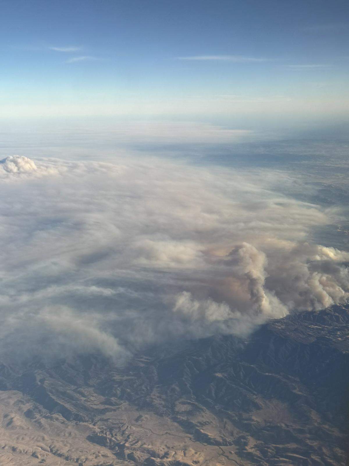A blanket of smoke was visible from the air above the Gifford Fire, which had burned nearly 100,000 acres in SLO and Santa Barbara counties as of Aug. 7, 2025.