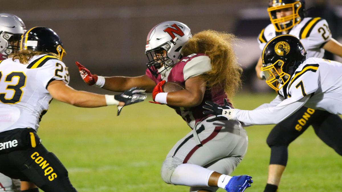 Nipomo High School’s Keyshawn Pu’a runs the ball Friday night against Cabrillo. The game was played at SLO High as Nipomo’s stadium is under construction.